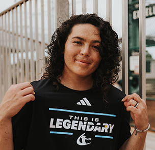 Rachel Garcia in a black and blue AUSL This is Legendary Tee